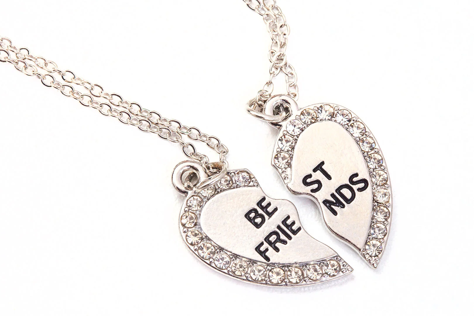 A heart locket in two pieces with the words 