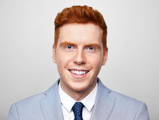 a smiling male Financial Analyst