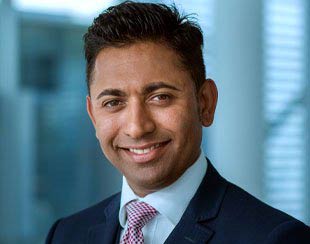 a smiling male professional