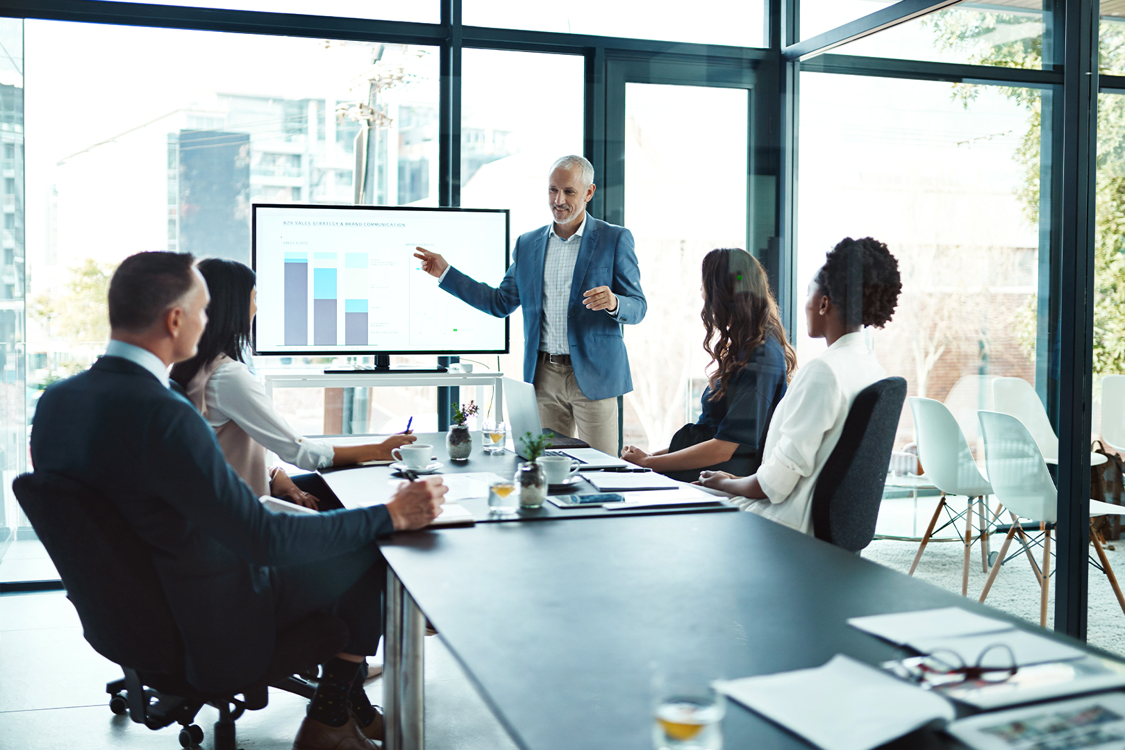 A CFO presenting information to a group in a meeting