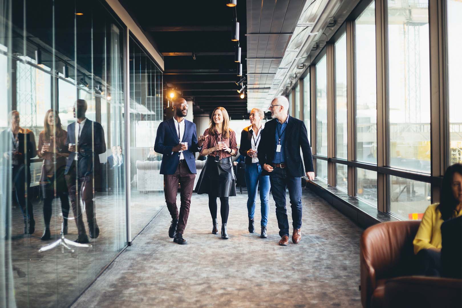 Professionals walking through modern work place